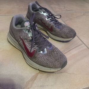 Gray and purple Nikes